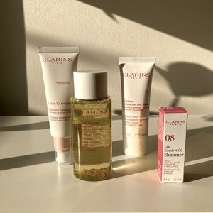 Clarins assorted skincare items and toiletry bag
